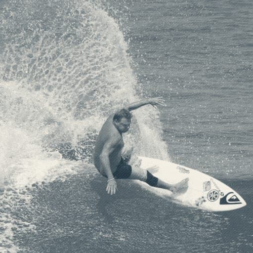 Close-up of Ryan Ragan mid-cutback with fanning spray